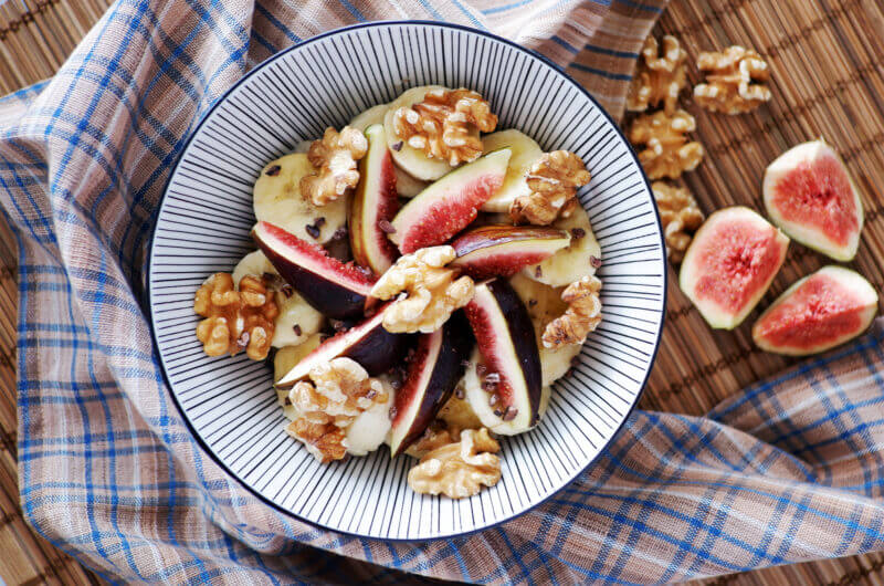 Oatmeal with almond milk, fresh figs, and walnuts