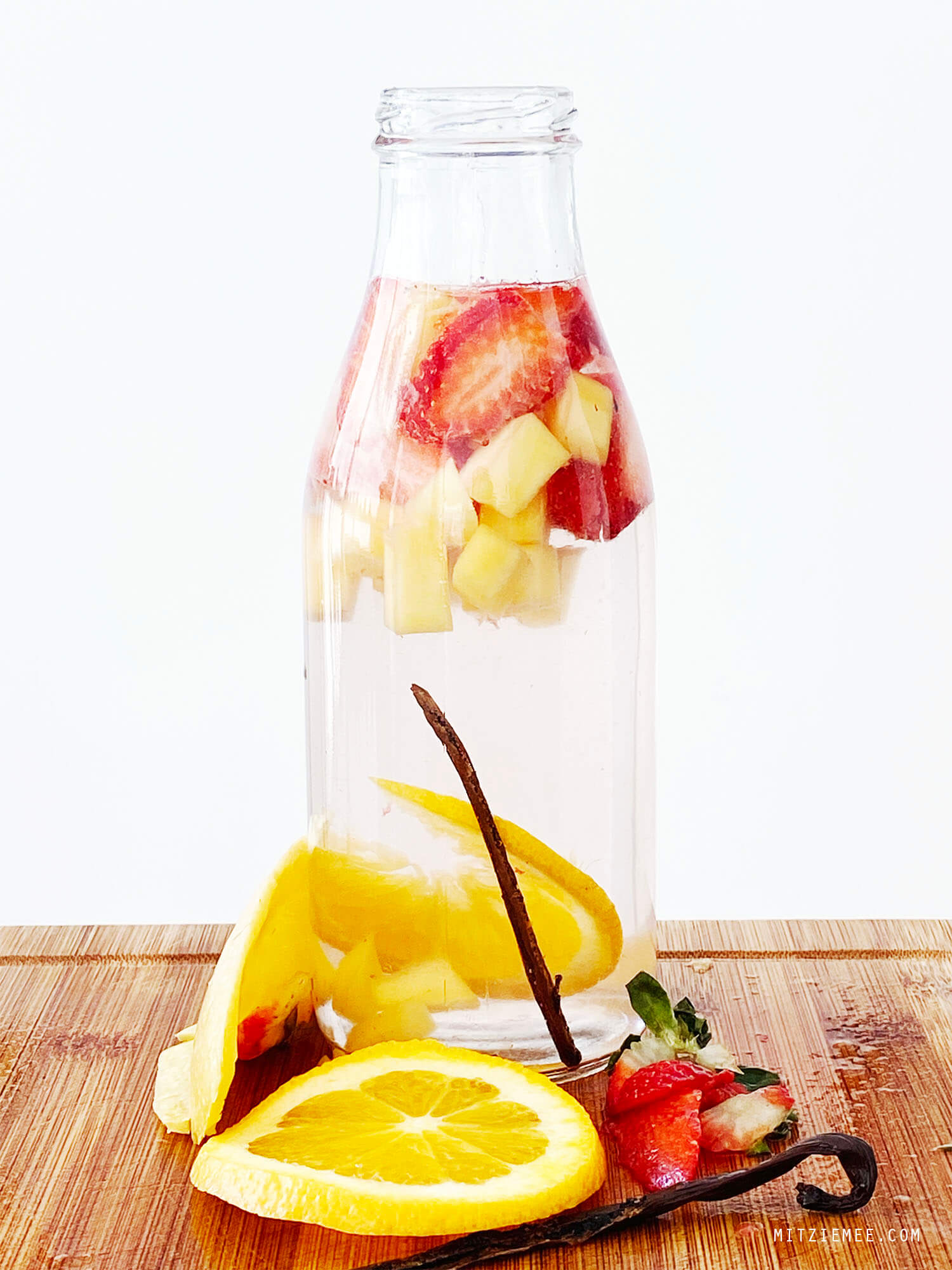 Infused water with strawberry, lemon, mango and vanilla