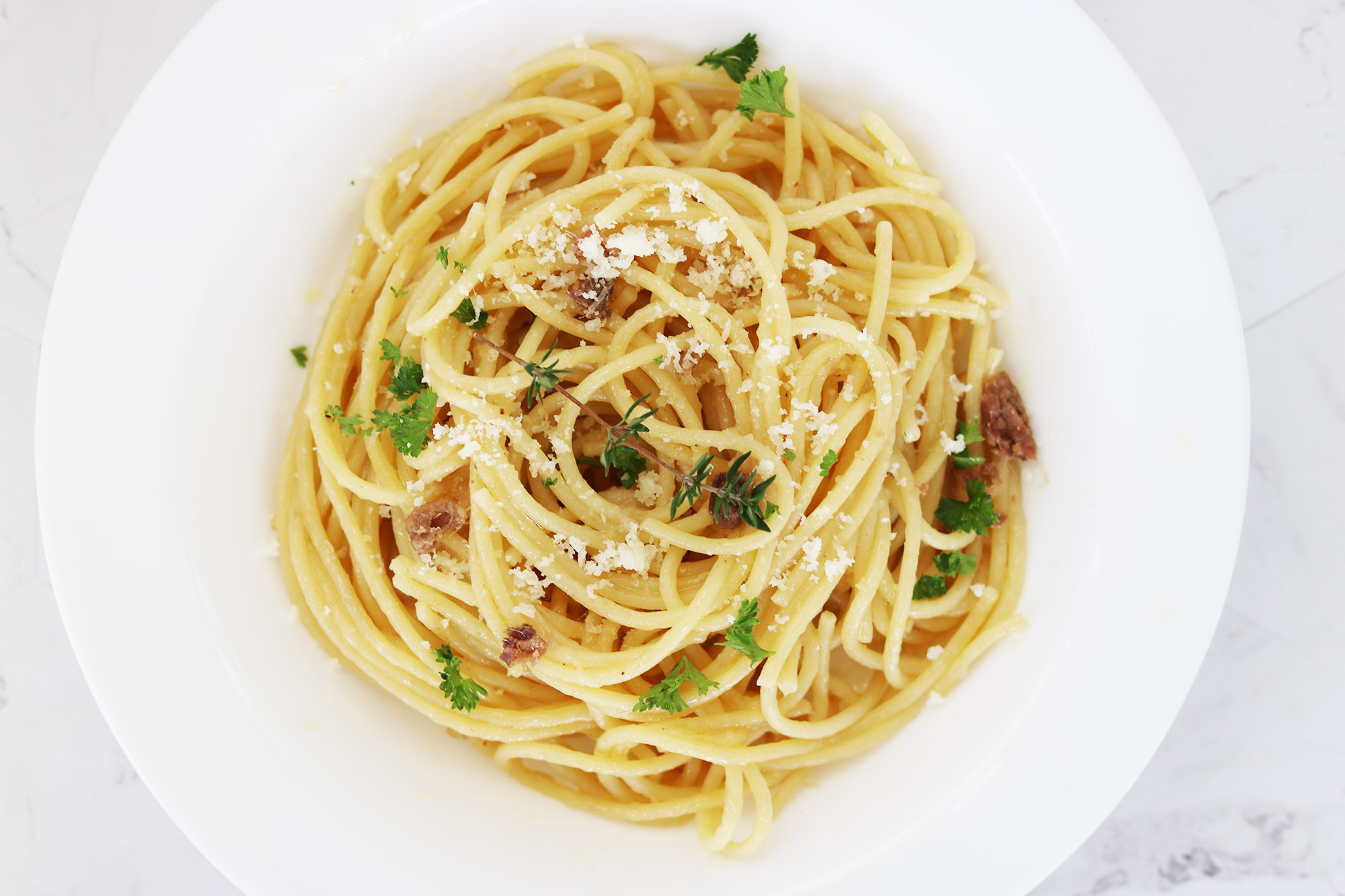 Pantry pasta with anchovies, parmesan cheese and garlic