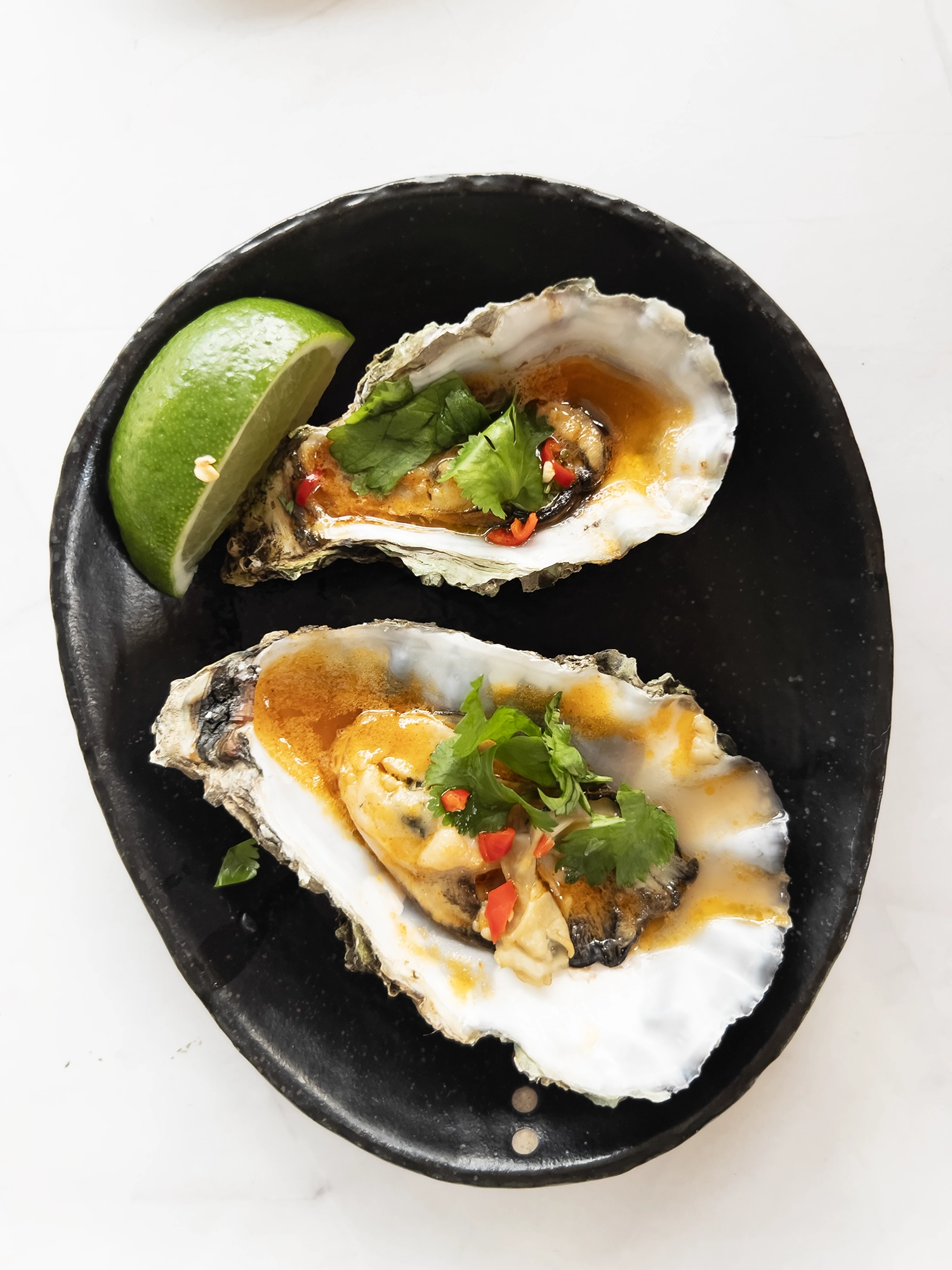Oysters in tom yum butter